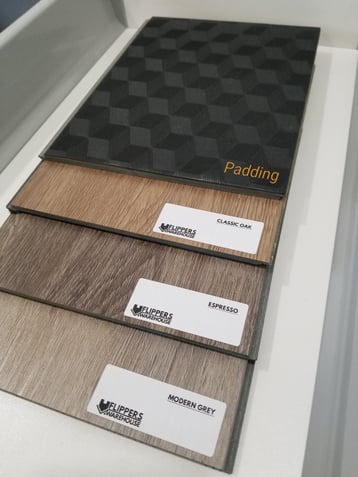 Vinyl flooring with rigid core and padding